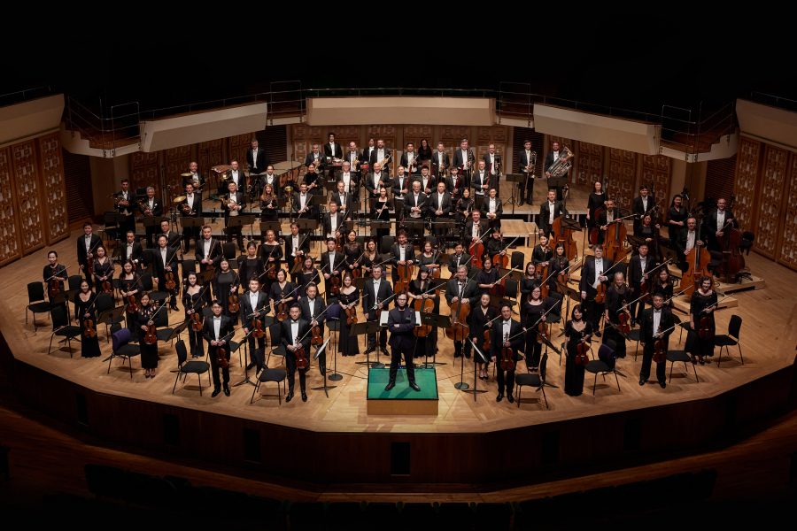 The Hong Kong Philharmonic Orchestra stands to attention.